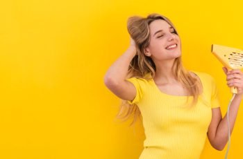 happy-woman-drying-her-hair
