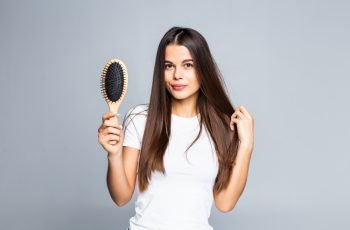 woman-combing-her-hair-isolated-white (1)